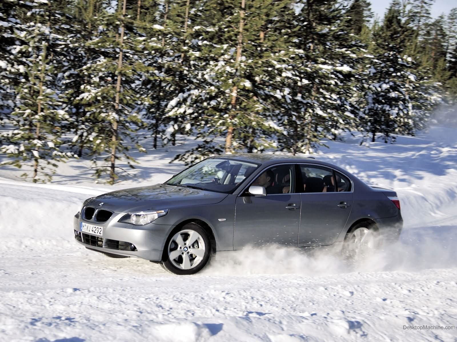 BMW driving on snowy road