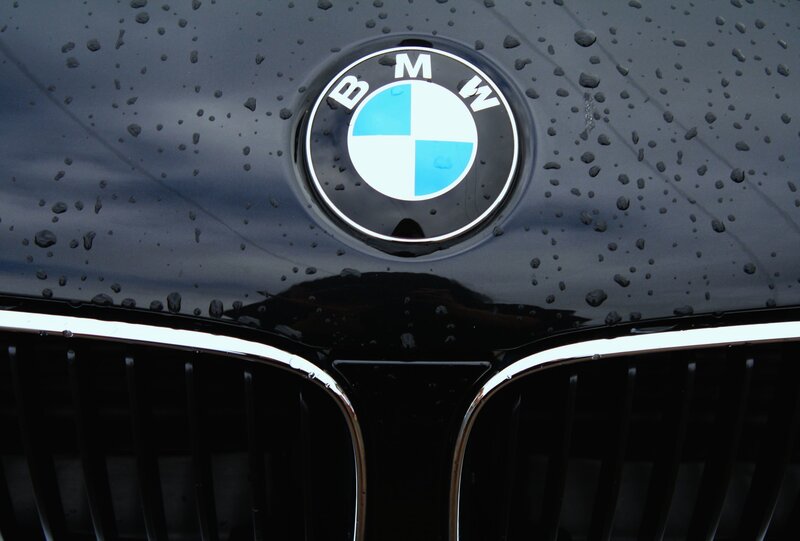 BMW emblem on wet car