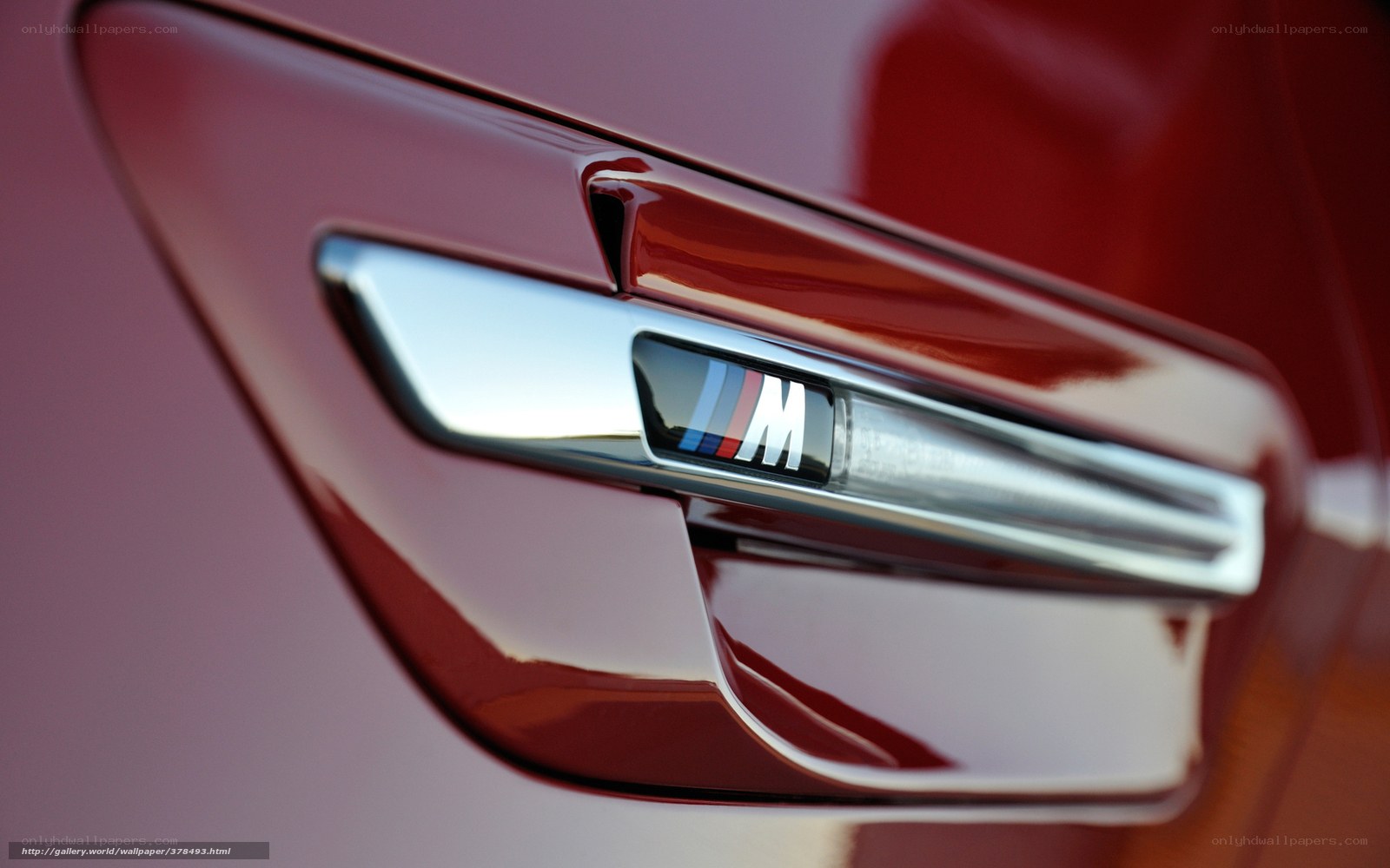 BMW M badge on red car