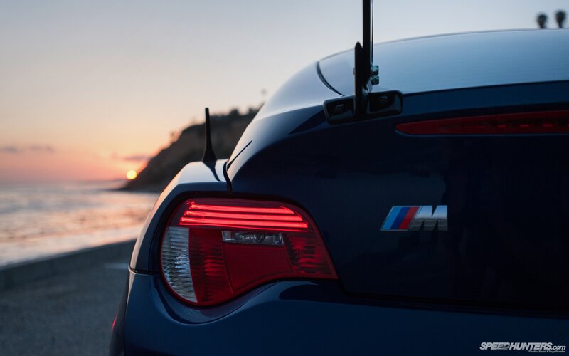 BMW M car at sunset by the coast