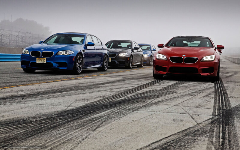 BMW M cars on a racetrack
