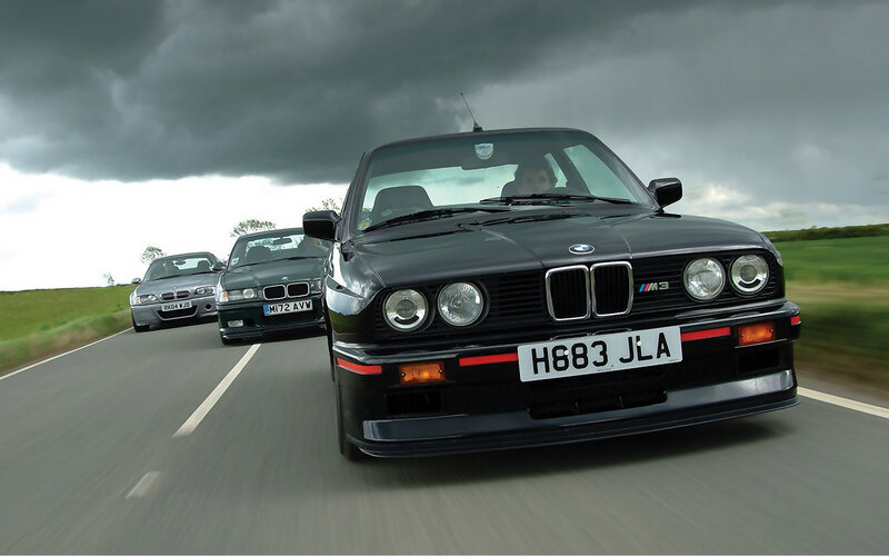 BMW M3 cars on a road