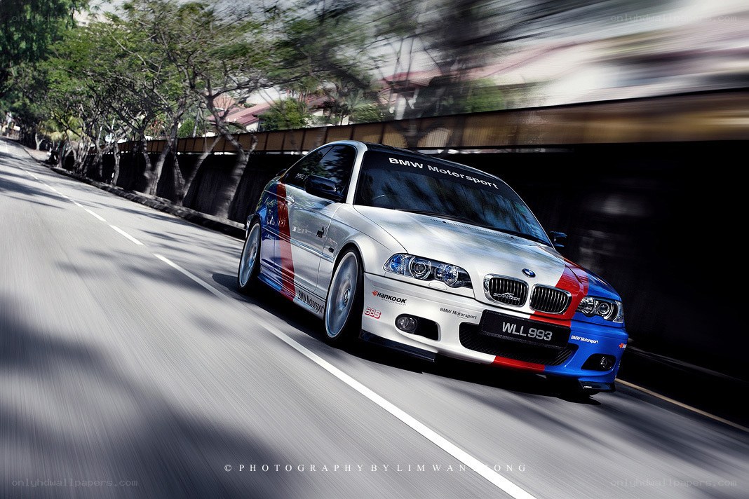 BMW M3 racing on a road