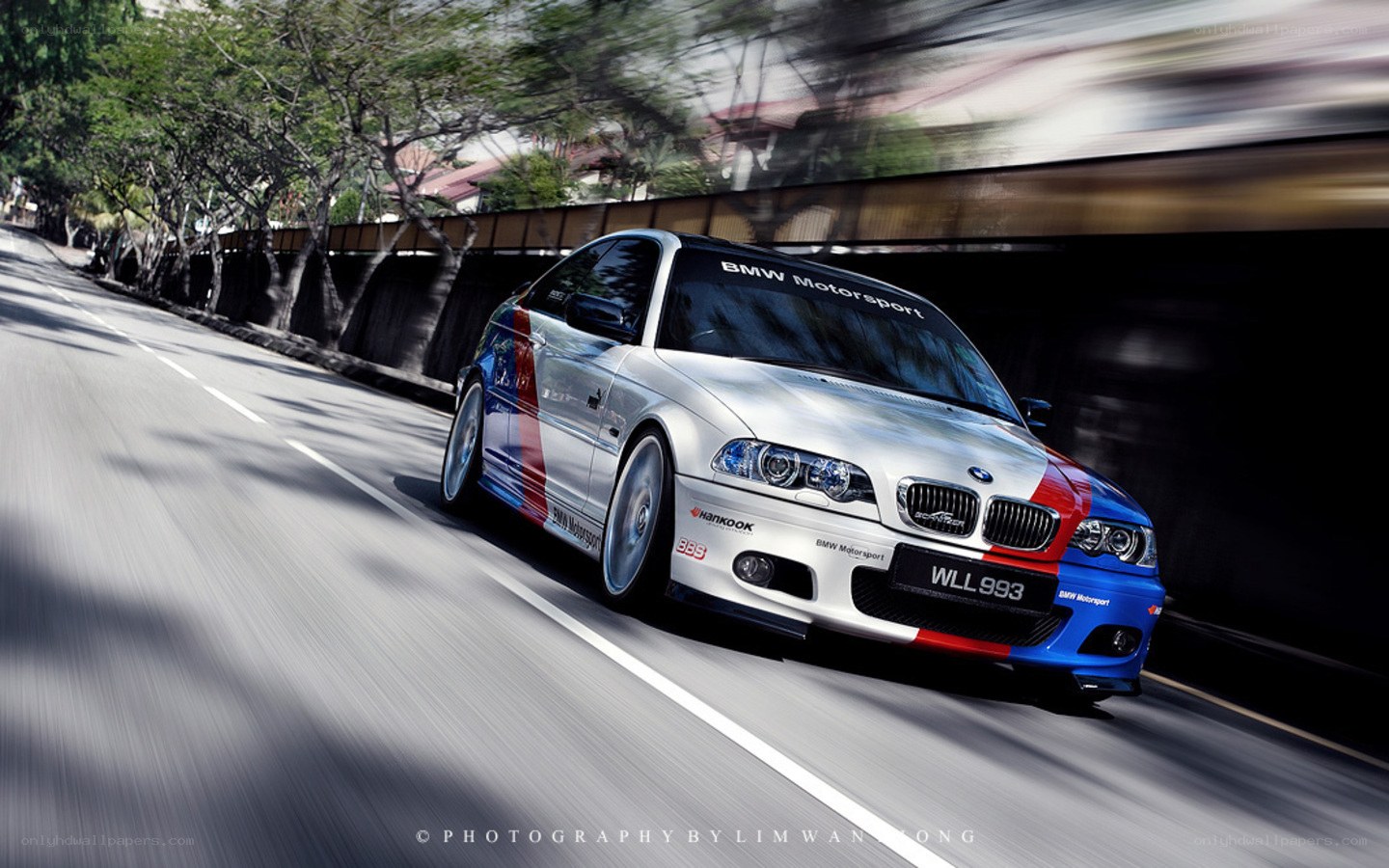 BMW M3 racing on a road