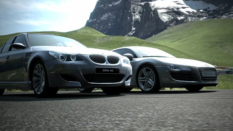 BMW M5 and Audi R8 on mountain road