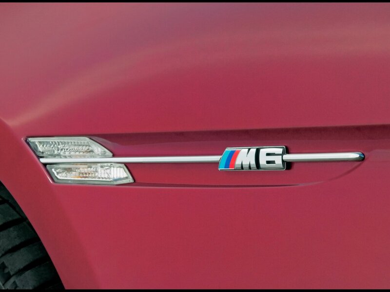 BMW M6 badge on red car