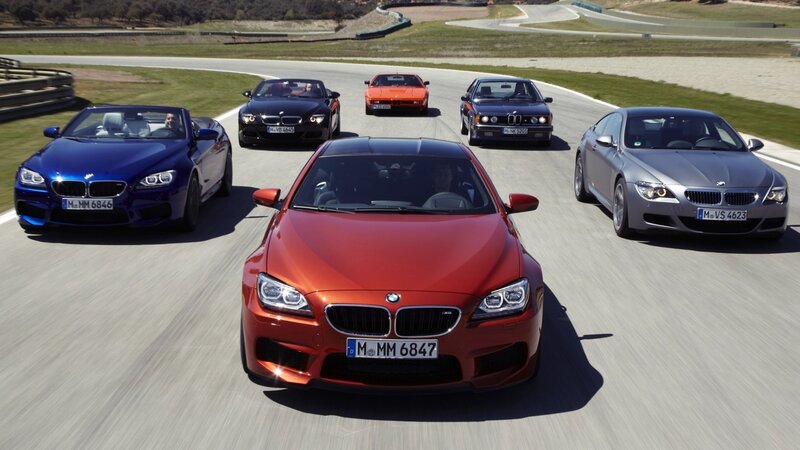 BMW M6 cars on a racetrack