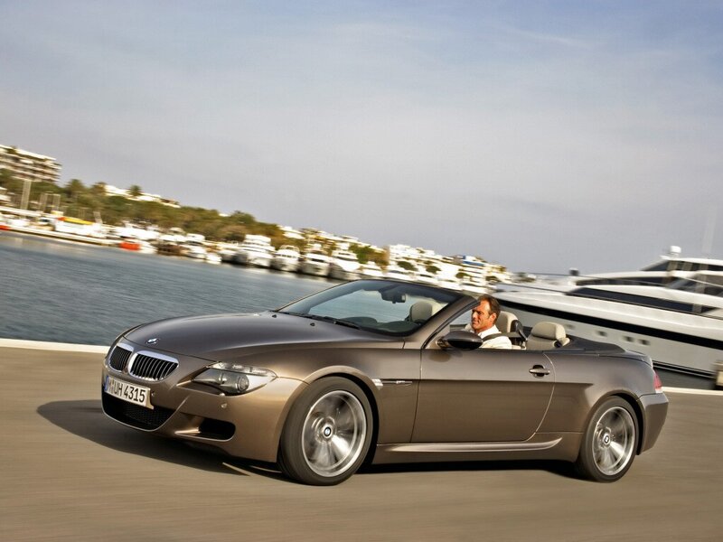 BMW M6 convertible driving by the marina