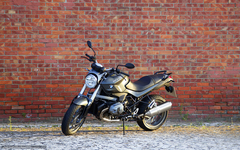 BMW motorcycle against brick wall