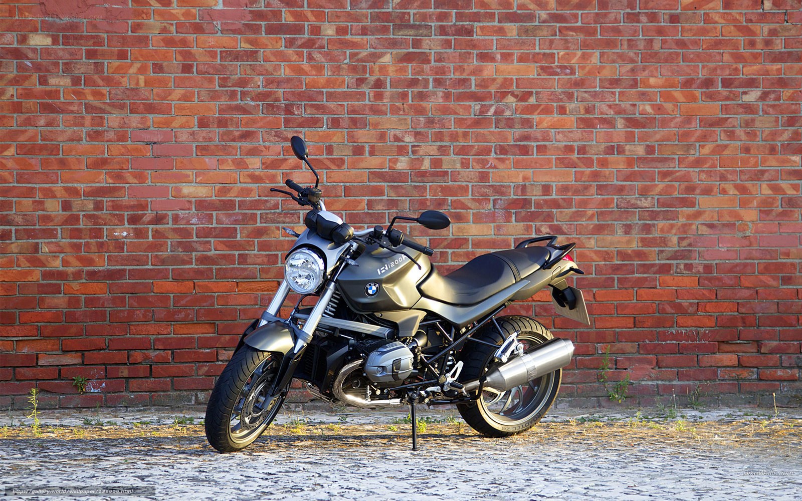 BMW motorcycle against brick wall