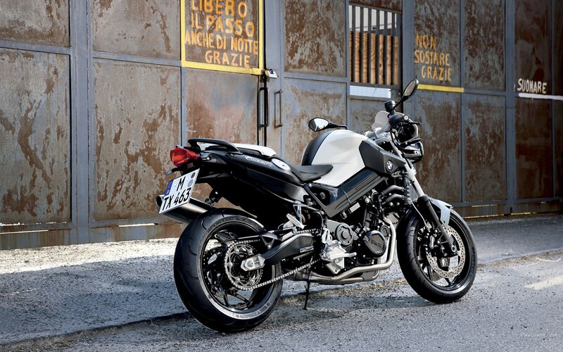 BMW motorcycle parked in alley