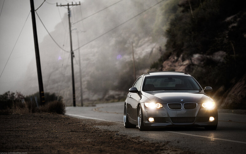 BMW on a foggy mountain road