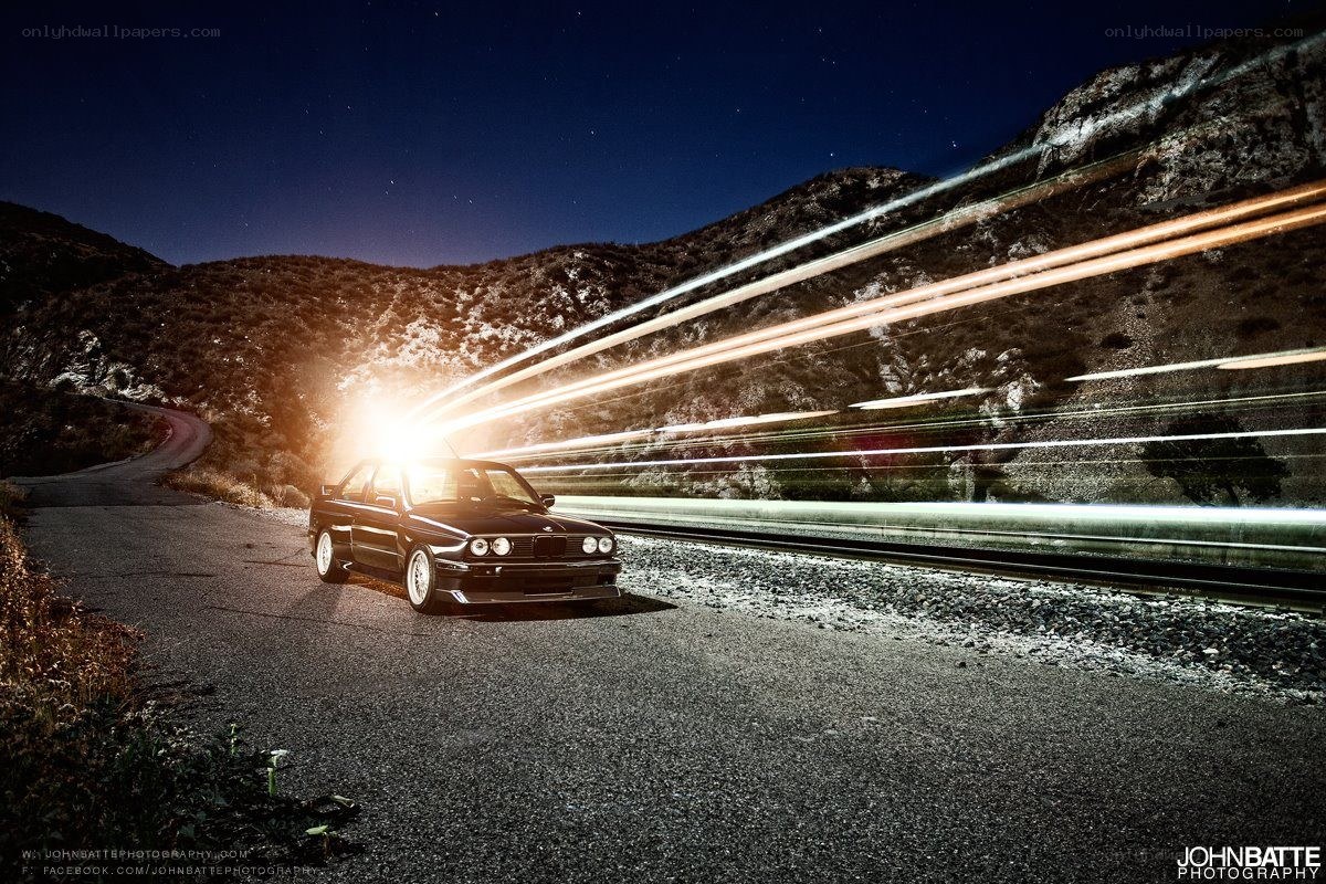BMW on a winding road at night