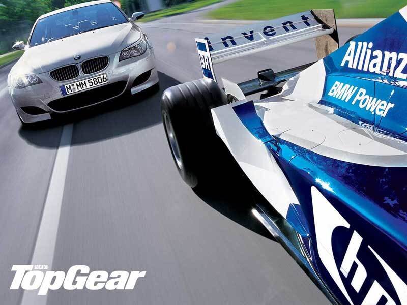 BMW race car and sedan on track