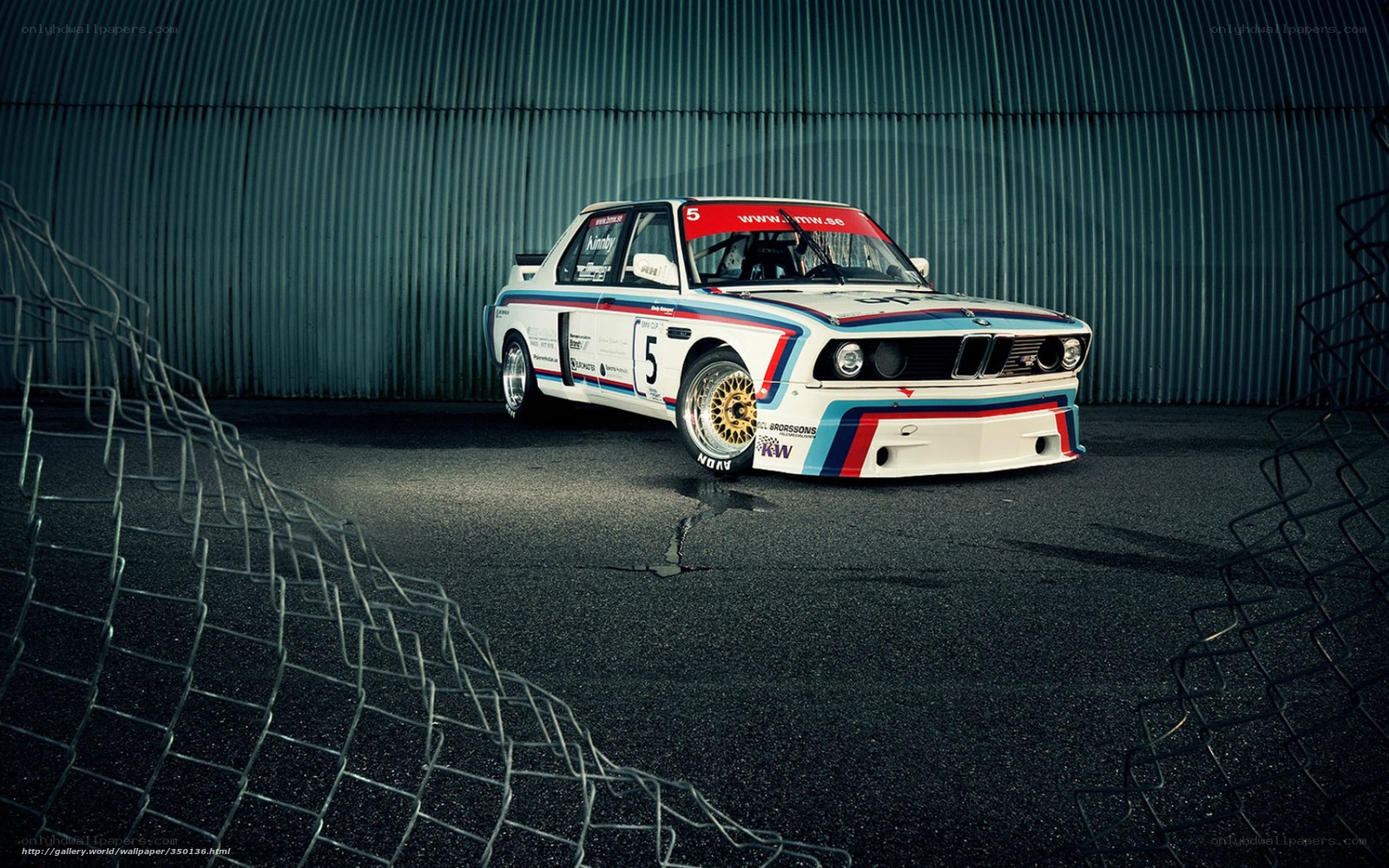 BMW race car in garage
