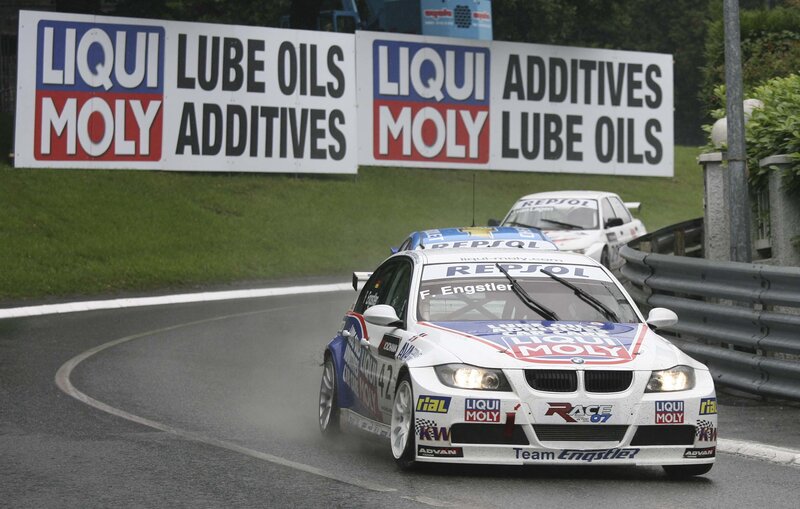 BMW race car on wet track