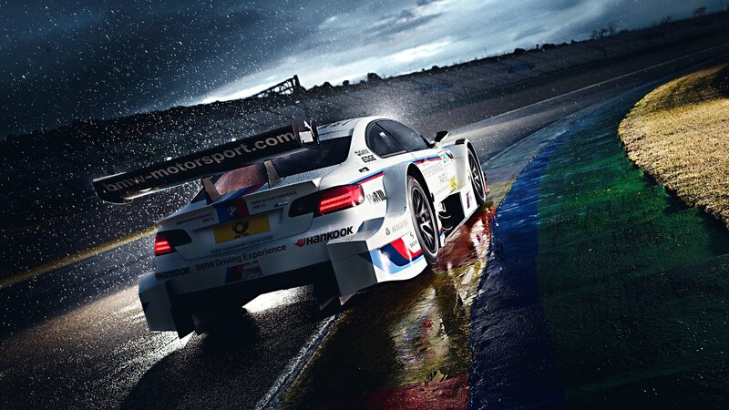BMW race car on wet track