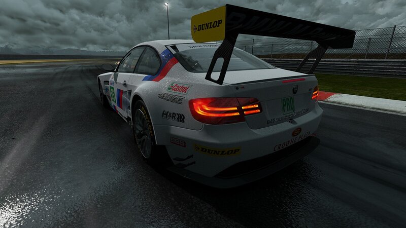 BMW race car on wet track