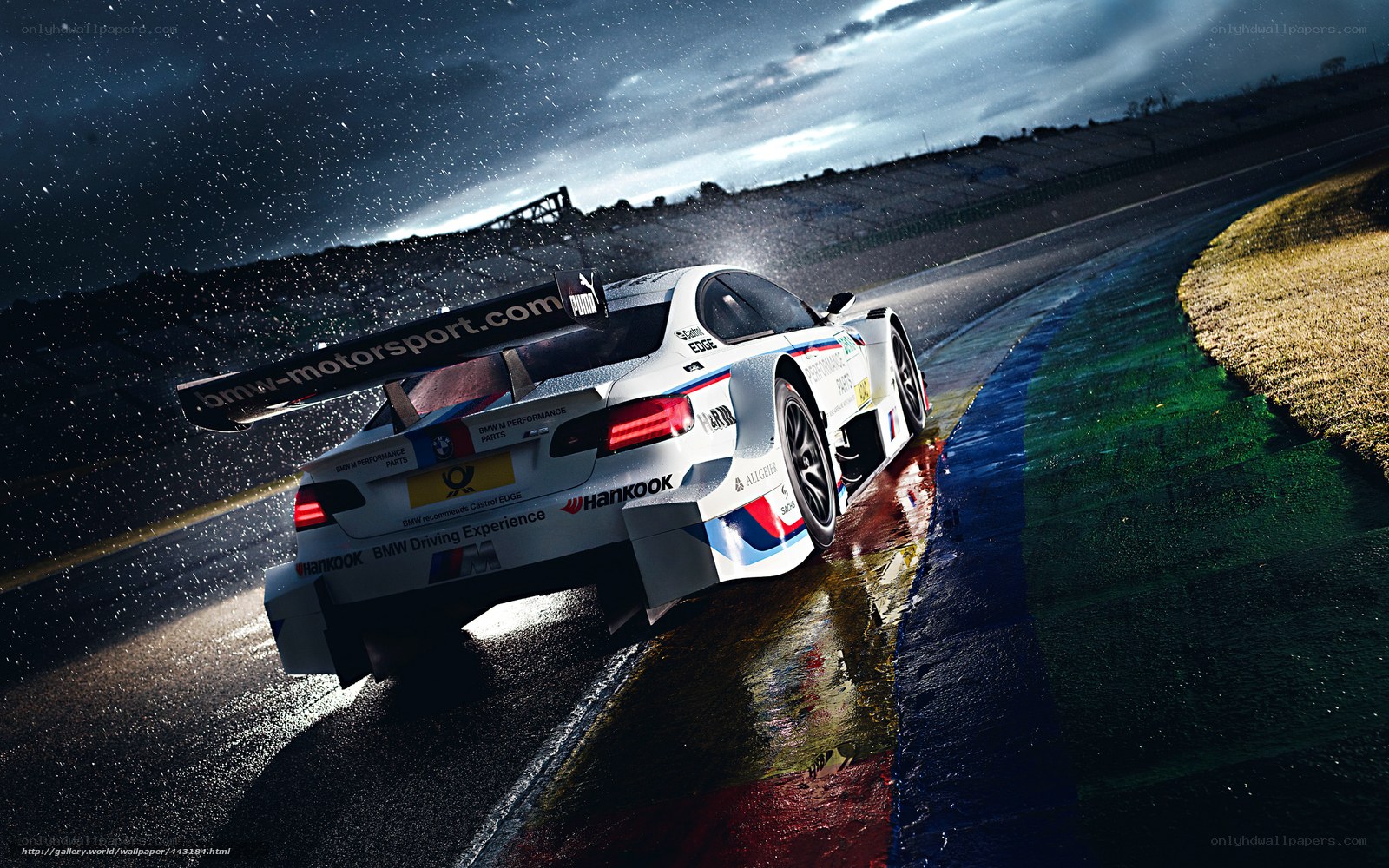 BMW race car on wet track