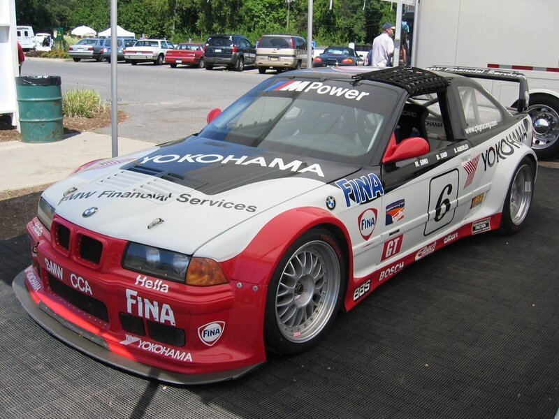 BMW race car with sponsor decals