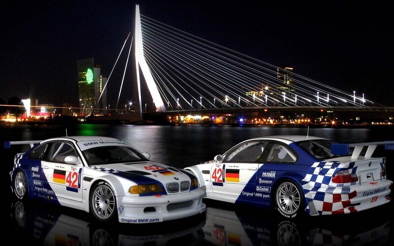 BMW race cars at night