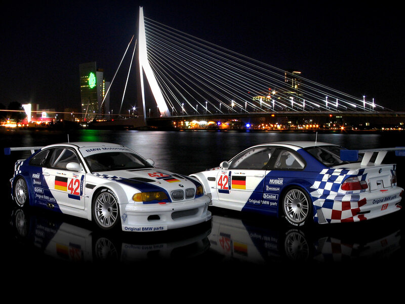 BMW race cars at night