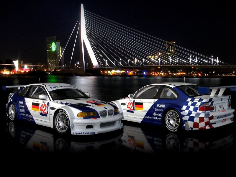 BMW race cars at night