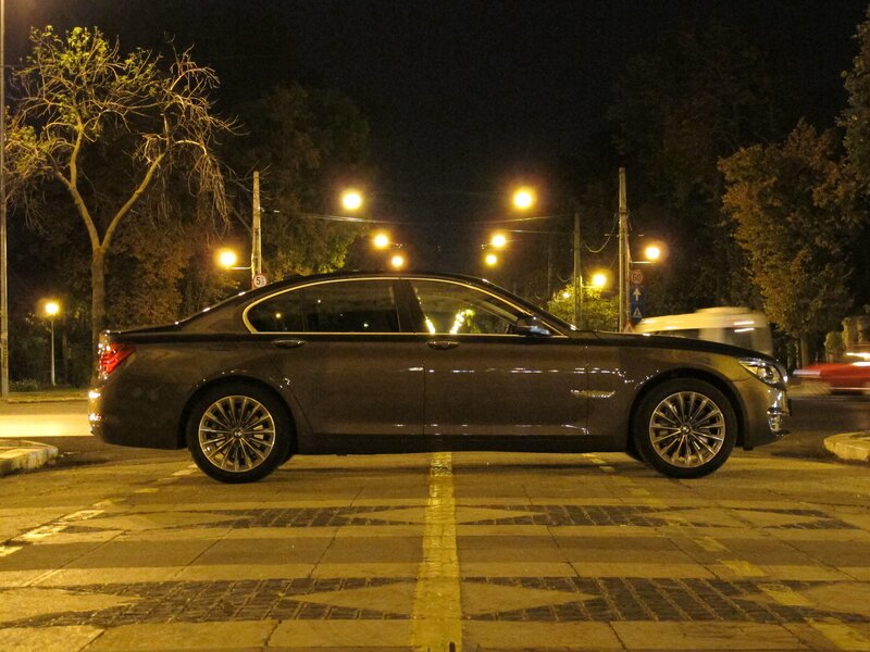 BMW sedan at night on street