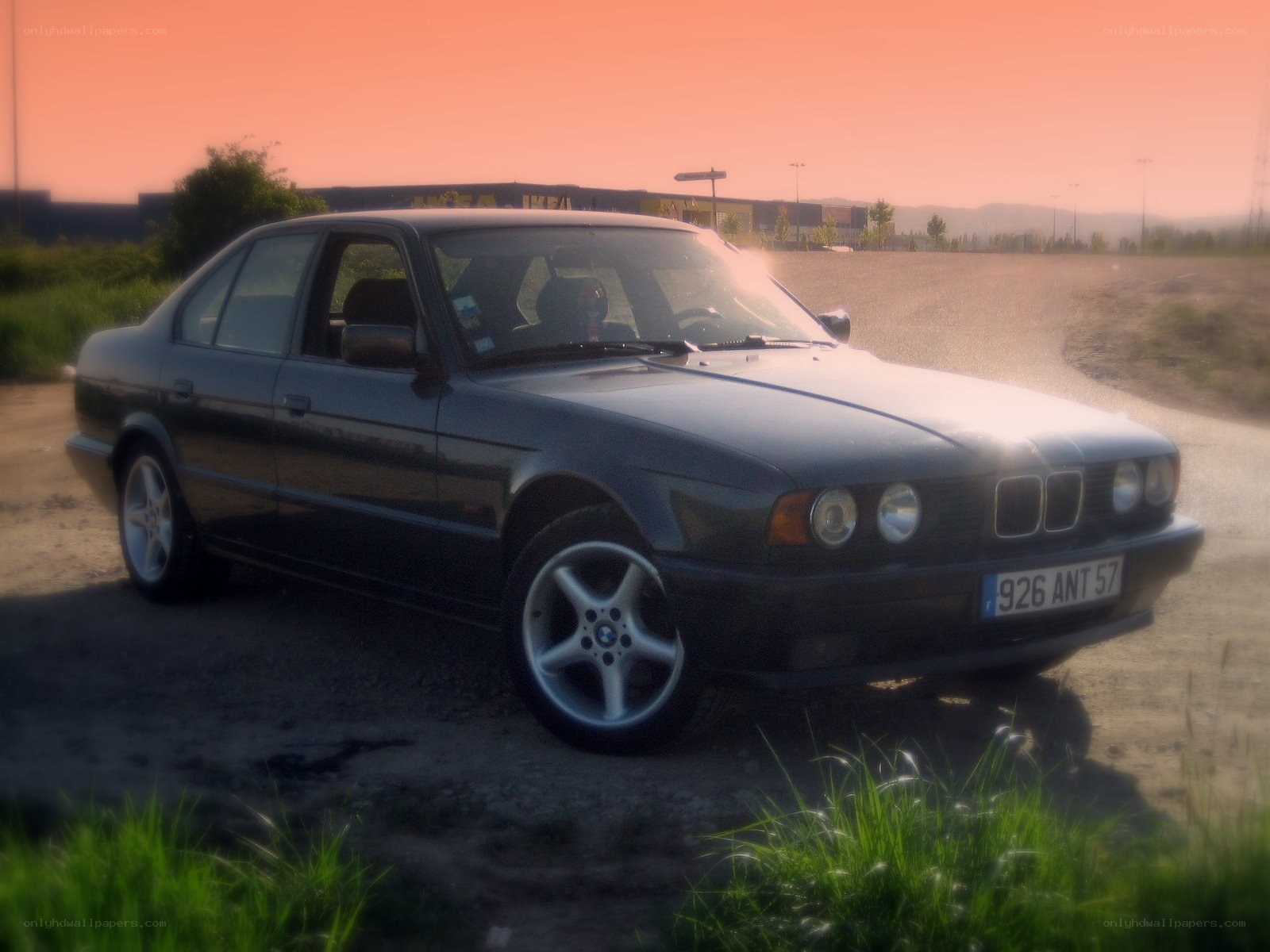 BMW sedan at sunset