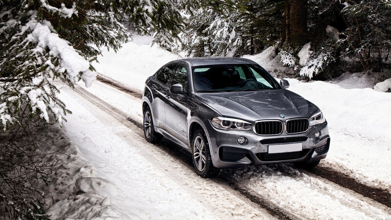 BMW SUV on snowy road
