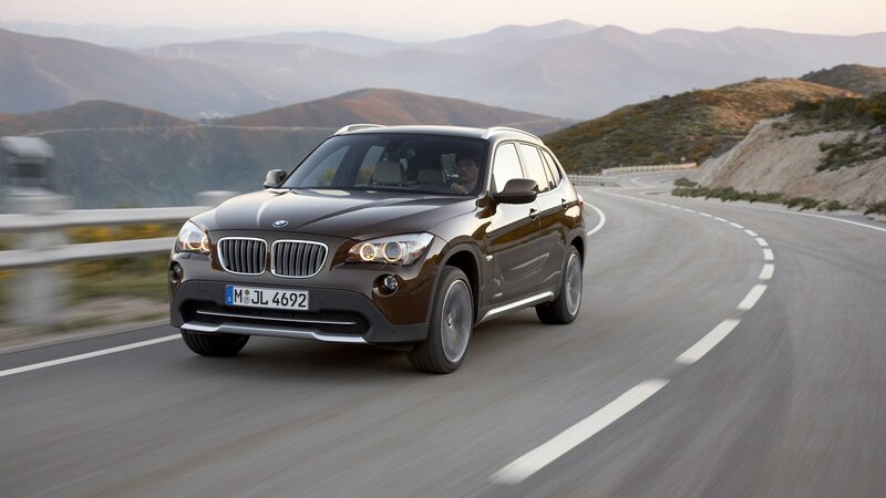 BMW X1 driving on mountain road