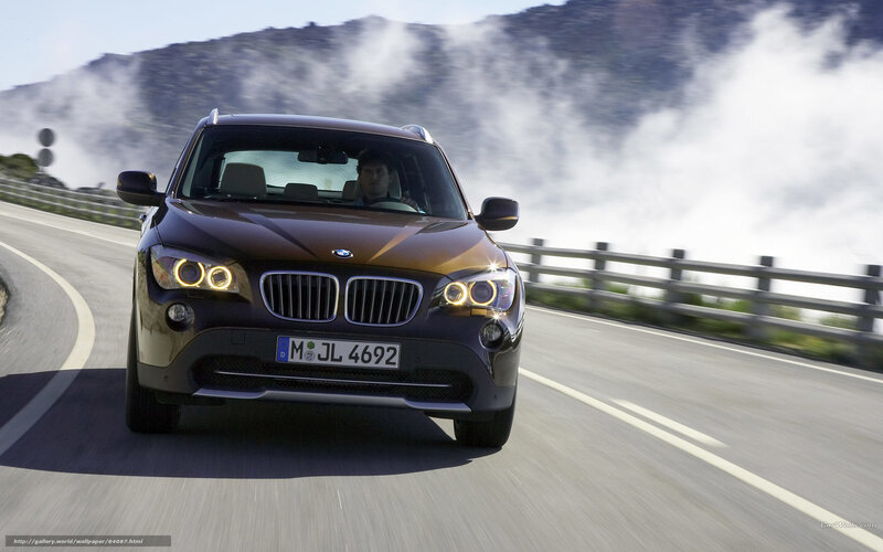 BMW X1 driving on mountain road