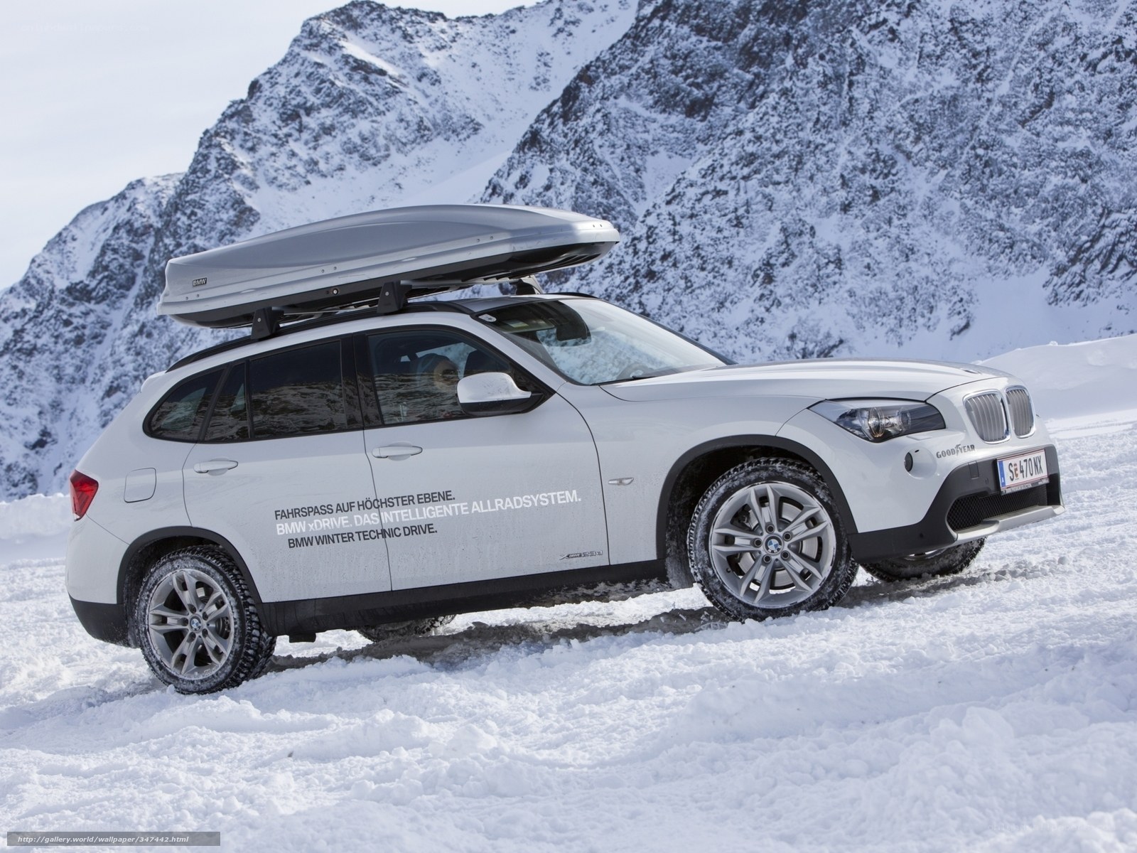 BMW X1 in snowy mountains