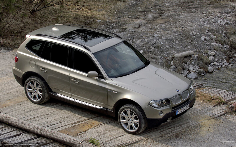 BMW X3 on wooden bridge