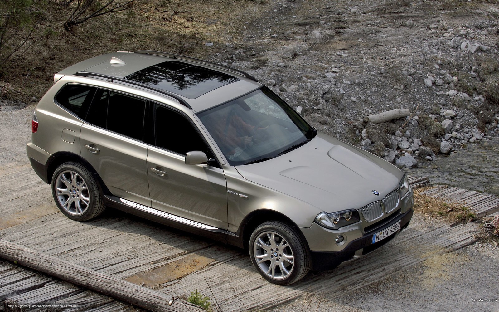 BMW X3 on wooden bridge