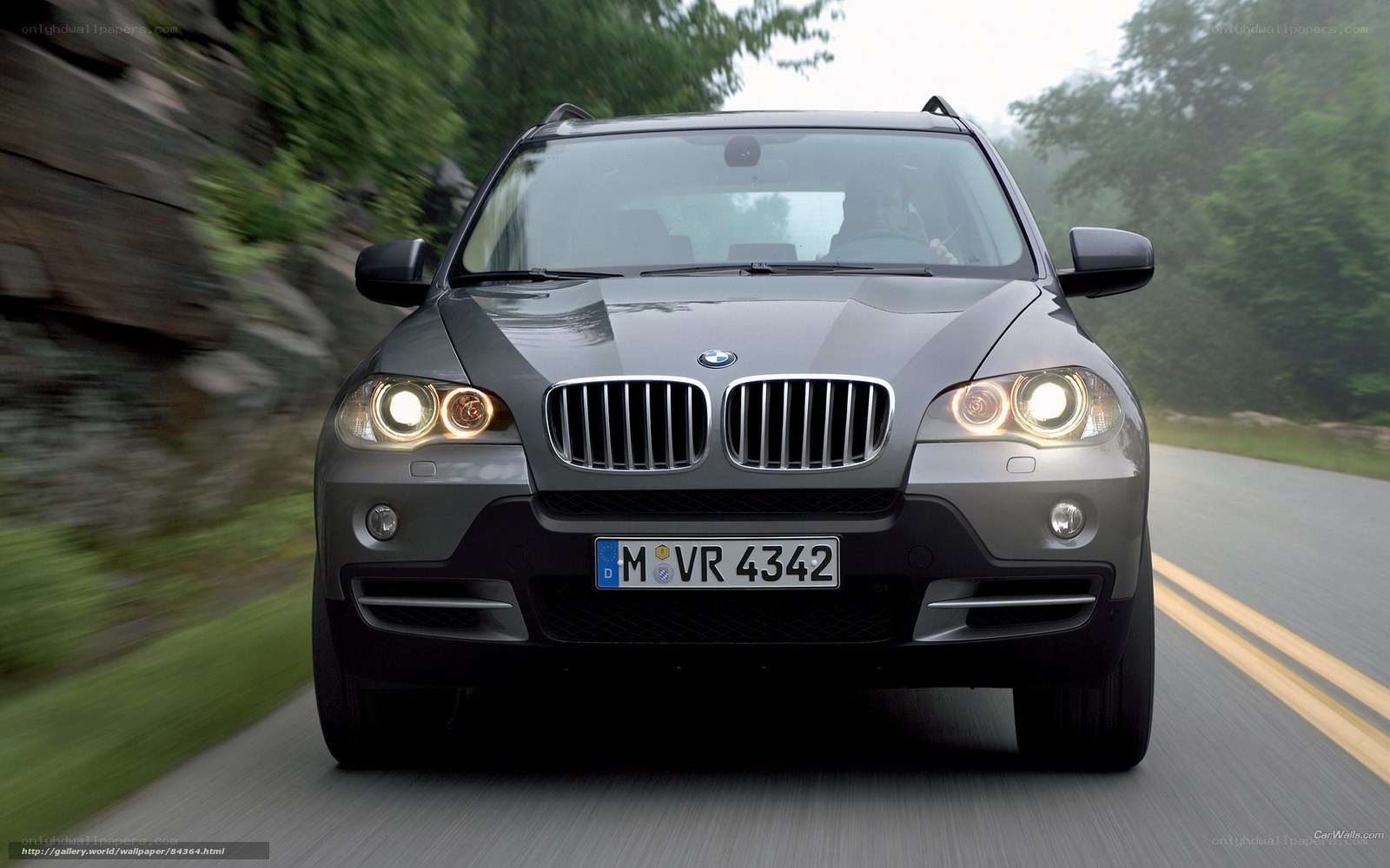 BMW X5 driving on a road