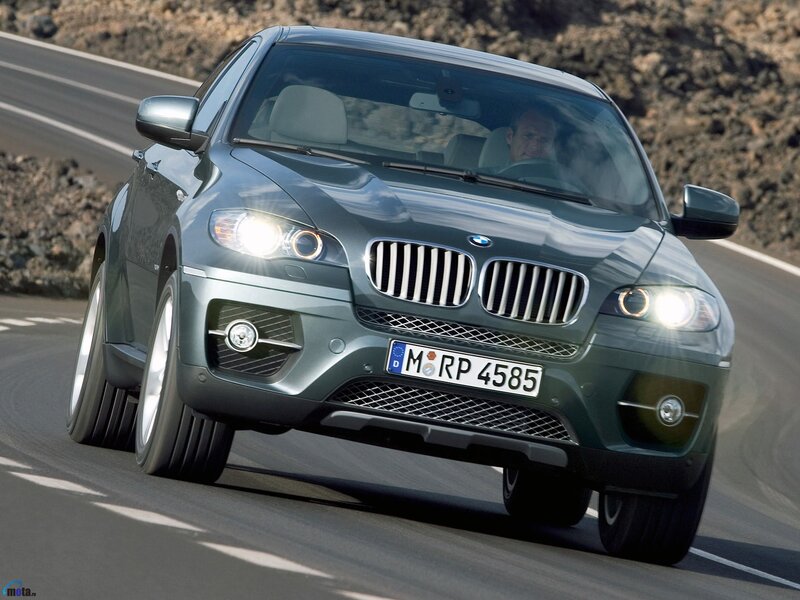 BMW X6 driving on a road