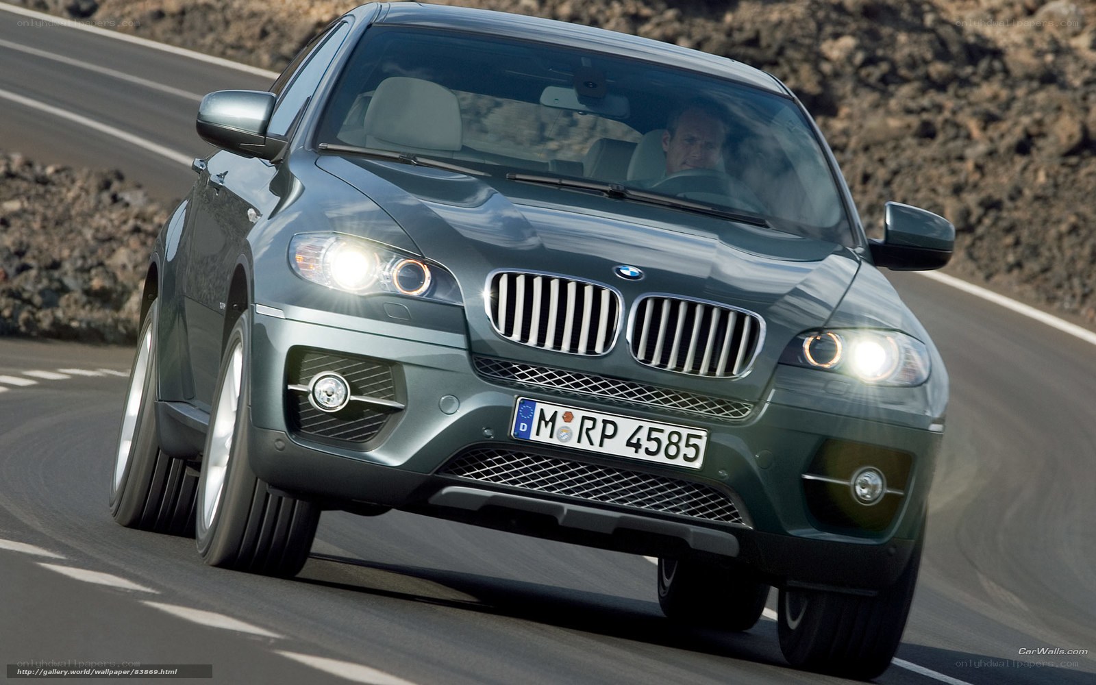 BMW X6 driving on a road