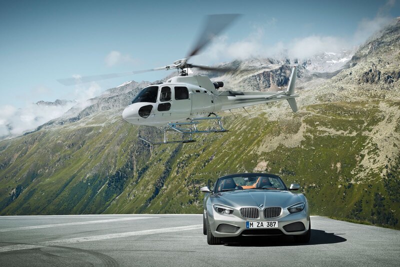 BMW Z4 and helicopter in mountains