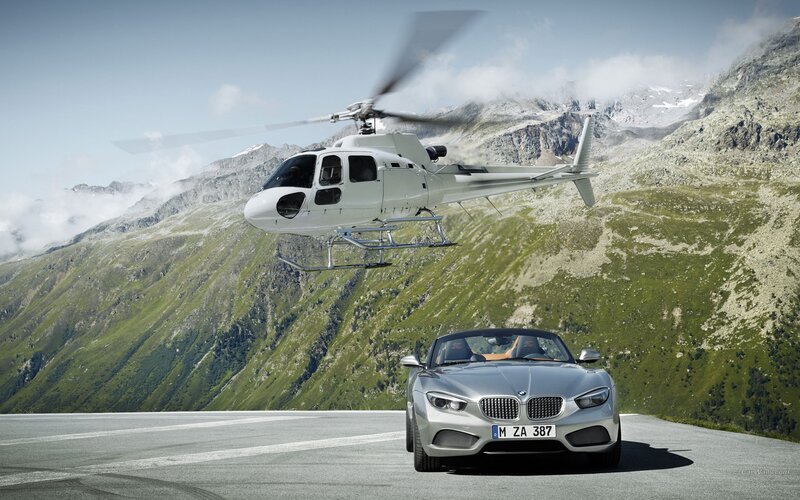 BMW Z4 and helicopter in mountains