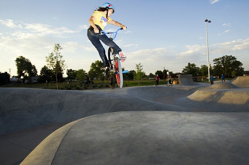 BMX rider in mid-air at skatepark
