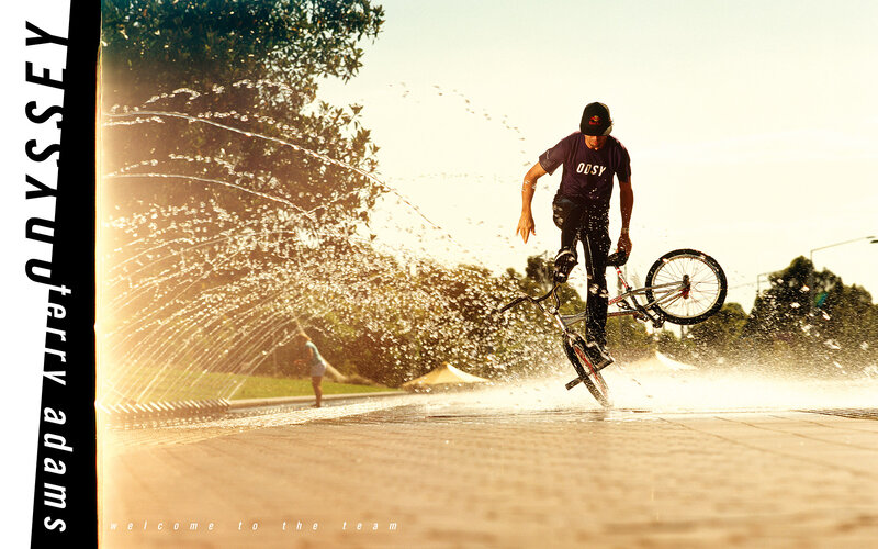 BMX rider in water spray