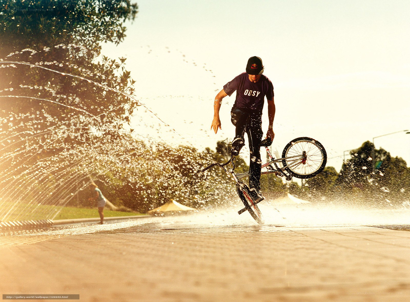 BMX rider in water spray