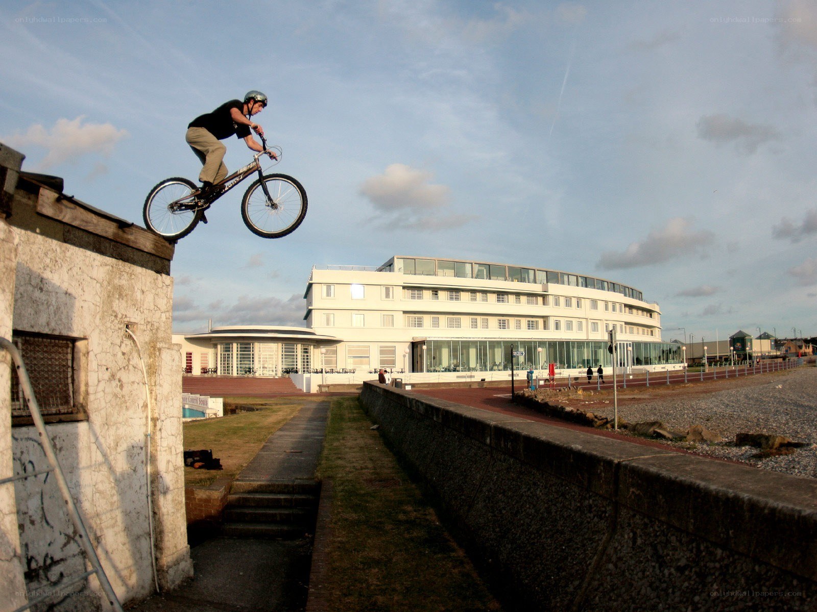 BMX rider jumps off wall
