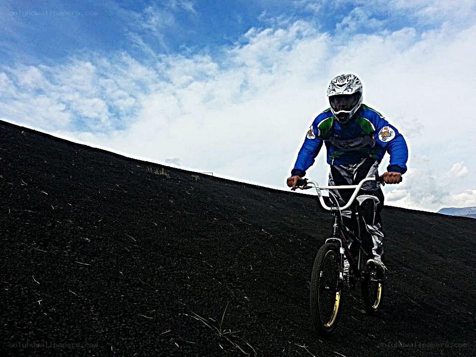 BMX rider on a black slope