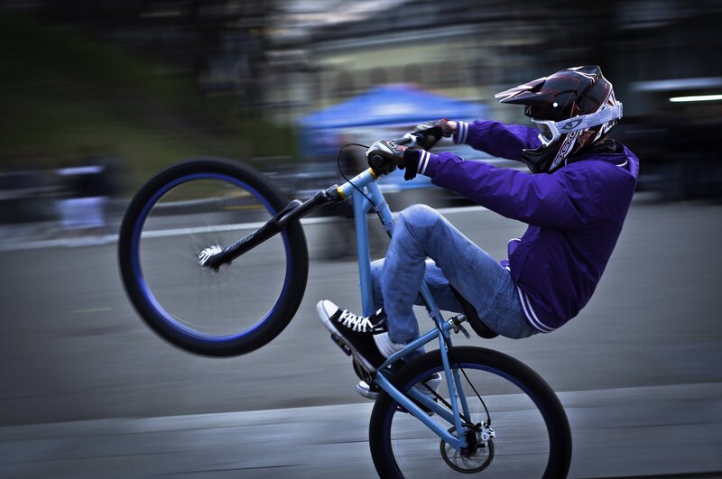 BMX rider performing wheelie