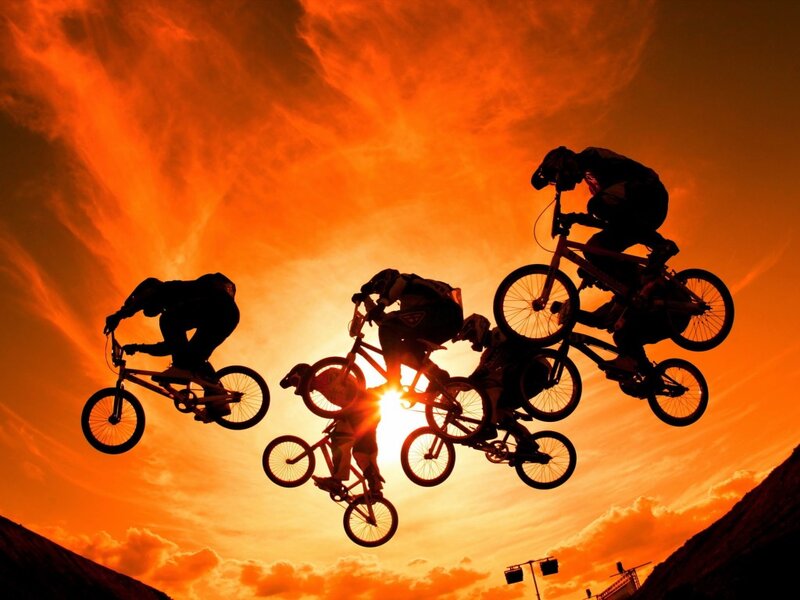 Bmx Riders in Mid-air — Orange