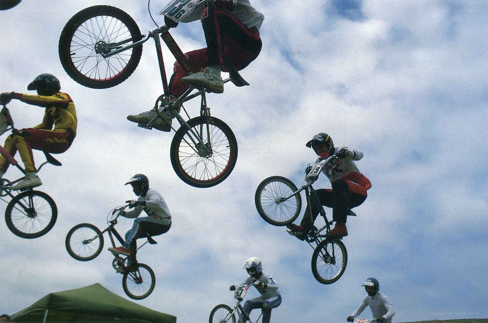 BMX riders in mid-air