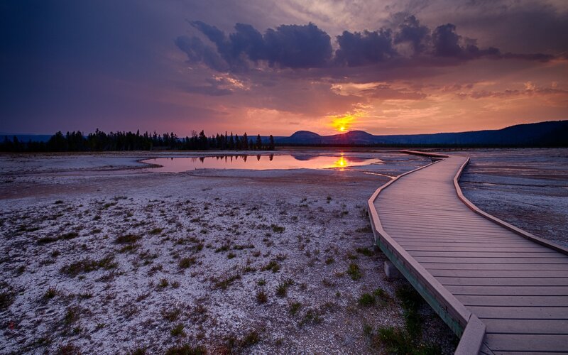 Boardwalk at sunset in a geothermal area
