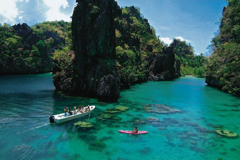 Boat and kayak in turquoise bay